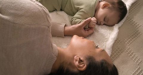 Mother and Baby Bonding on Cozy Bed