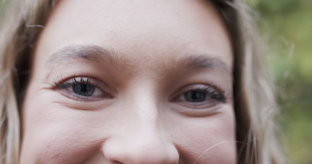 Close-Up of Smiling Woman's Eyes with Bright Lighting and Natural Background - Download Free Stock Images Pikwizard.com