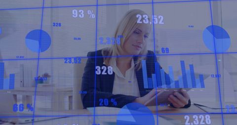 Businesswoman Analyzing Data on Tablet with Financial Graphs Overlay