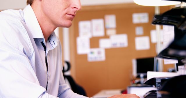 Focused Professional Working at Office Desk with Computer - Download Free Stock Images Pikwizard.com