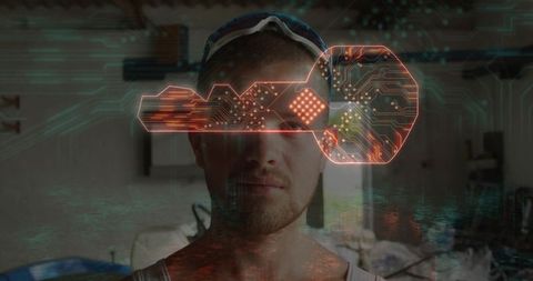 Maker wearing safety goggles in garage workshop interacting with holographic circuit key