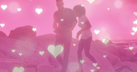 Romantic Couple Walking on Beach with Heart Overlay