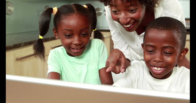 African American Child Learning with Parent Using Laptop in Kitchen - Download Free Stock Images Pikwizard.com