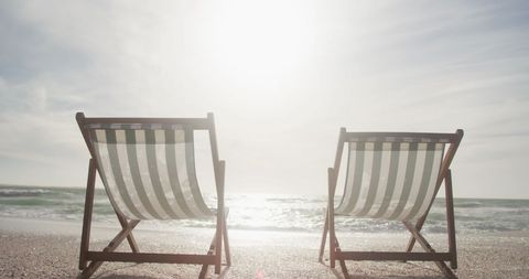 Empty Deckchairs by Tranquil Sea at Sunrise - Download Free Stock Images Pikwizard.com