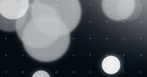 Monochrome bokeh discs with plus-grid overlay for futuristic digital design