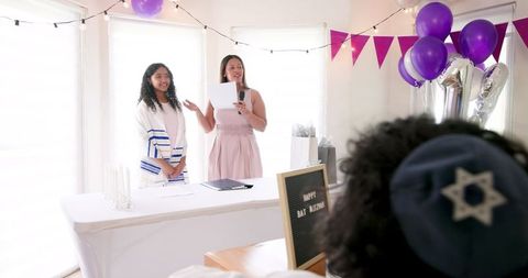 Family celebrating traditions in decorated home setting