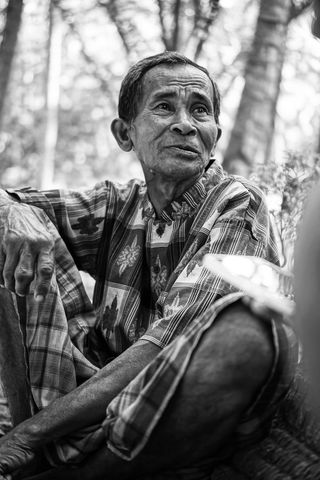 Elderly Asian Man Resting in Tropical Outdoors, Black and White Portrait