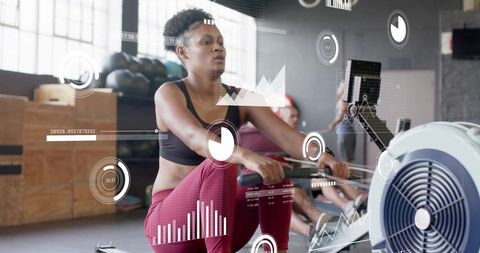 Digital health analytics with woman on rowing machine