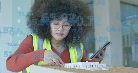 Female Architect Analyzing Building Model with Digital Interface - Download Free Stock Images Pikwizard.com