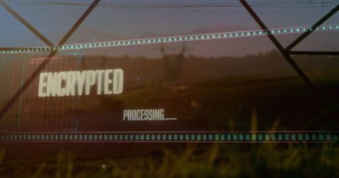 Displaying ENCRYPTED and PROCESSING overlay on rural roadside field at dusk with HUD