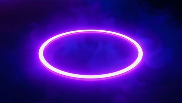 Futuristic neon purple ring with glowing halo effect