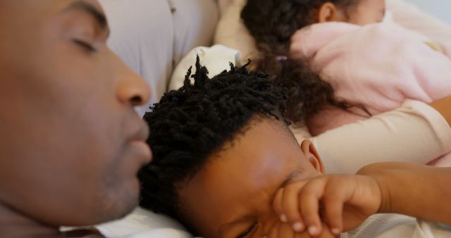 Father and Children Napping Together in Bed - Download Free Stock Images Pikwizard.com