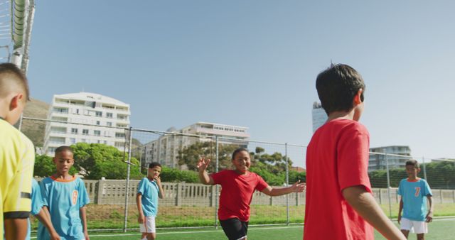 Kids Playing Football on Sunny Day in Urban Soccer Field - Download Free Stock Images Pikwizard.com