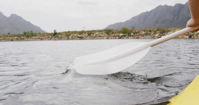Close-Up of Kayak Paddle in Water on Mountain Lake - Download Free Stock Images Pikwizard.com