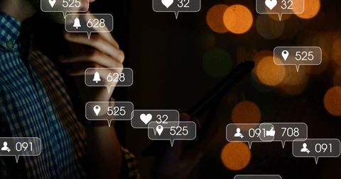 Man Analyzing Social Media Metrics on Smartphone at Night