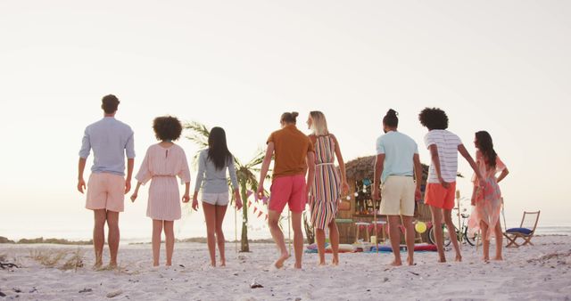 Group of Friends Standing on Beach at Sunset - Download Free Stock Images Pikwizard.com