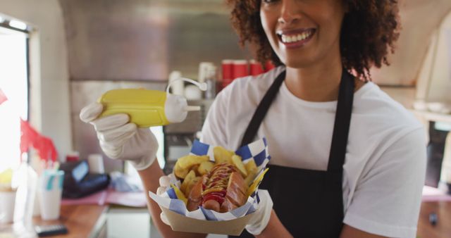 Smiling Vendor Serving Hot Dog with Mustard from Food Truck - Download Free Stock Images Pikwizard.com