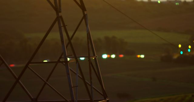 Electric Power Tower at Sunset Over Rolling Fields - Download Free Stock Images Pikwizard.com