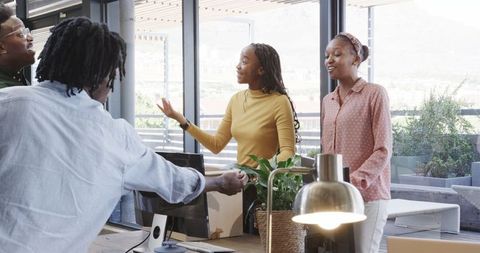African American Women Collaborating in Modern Office Setting