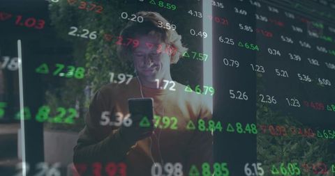 Man analyzing stock market data on smartphone in modern lounge