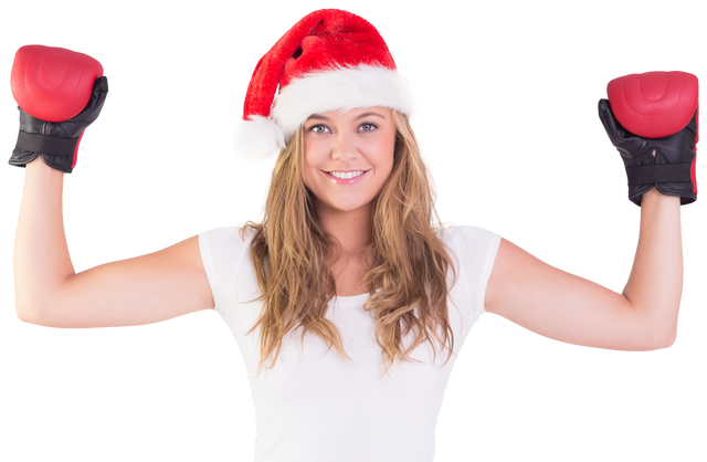 Festive blonde wearing red Santa hat and boxing gloves on transparent background - Download Free Stock Videos Pikwizard.com