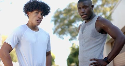 Diverse runners taking a break outdoors