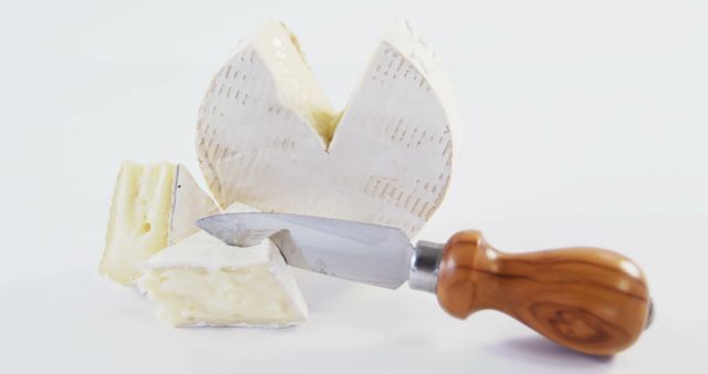 Sliced Brie Cheese with Wooden Handle Knife on White Background - Download Free Stock Images Pikwizard.com