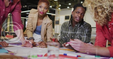 Diverse Team Brainstorming with Digital Overlay in Modern Office