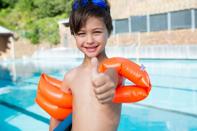 Happy Boy Giving Thumbs Up at Poolside - Download Free Stock Photos Pikwizard.com