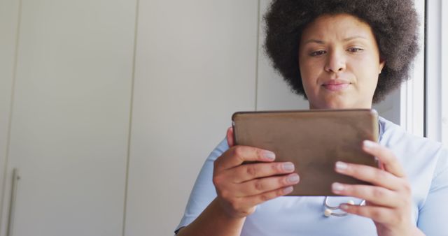 Healthcare professional using tablet for telehealth consultation - Download Free Stock Images Pikwizard.com