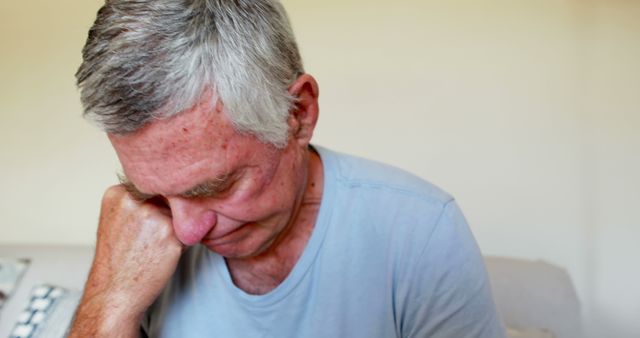 Elderly Man Deep In Thought Sitting Indoors - Download Free Stock Images Pikwizard.com