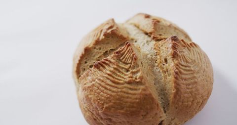 Close-up of artisanal sourdough bread on white background