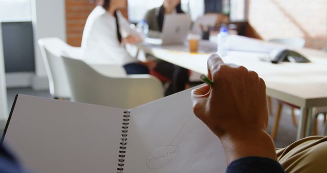 Team Meeting in Modern Office with Close-up of Hand Writing in Notebook - Download Free Stock Images Pikwizard.com