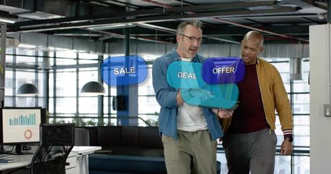 Colleagues walking and collaborating on tablet with holographic sale deal and analytics