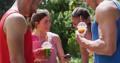 Group Relaxing with Smoothies After Outdoor Yoga Session
