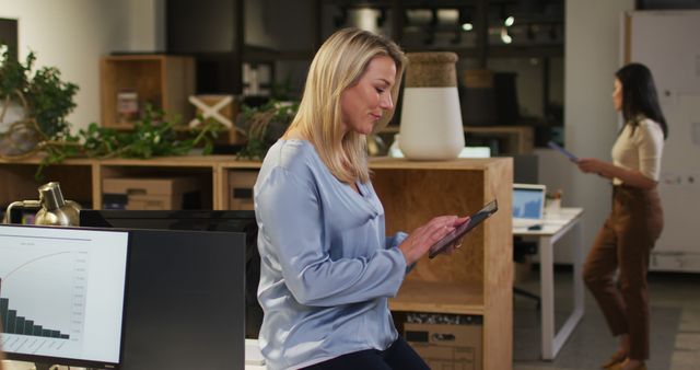 Businesswoman Working on Tablet in Modern Office Space - Download Free Stock Images Pikwizard.com