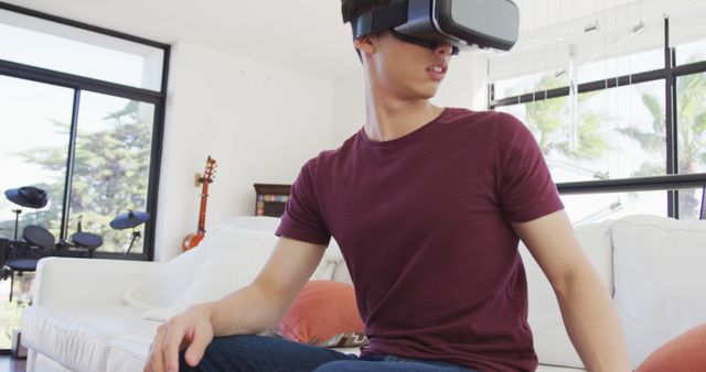 Young Asian Man Experiencing Virtual Reality at Home - Download Free Stock Images Pikwizard.com