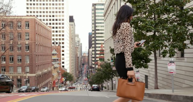 Businesswoman Walking in Urban Landscape While Using Smartphone - Download Free Stock Images Pikwizard.com