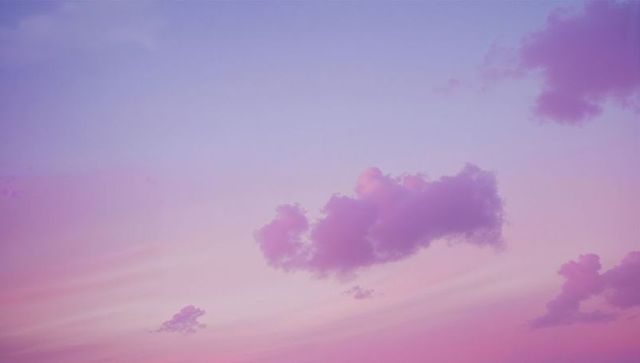 Serene twilight sky with pastel pink and purple clouds