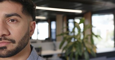 Focused Indian Man Working in Modern Office Environment