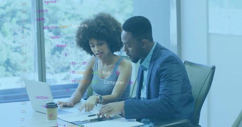 Colleagues Collaborating on Project at Modern Office Conference Table