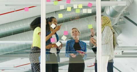 Diverse team collaborating in modern office on creative ideas