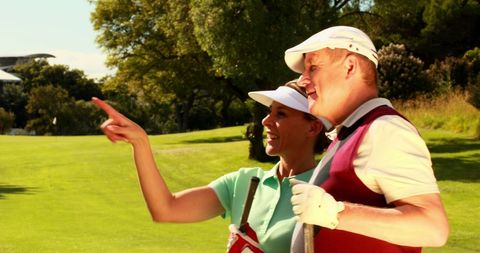 Couple Enjoying Sunny Day on Golf Course