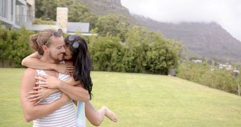Happy Couple Enjoying a Sunny Day in Scenic Mountain Garden