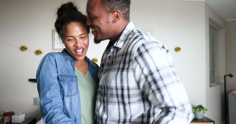 Happy Couple Celebrating Together in a Cozy Home