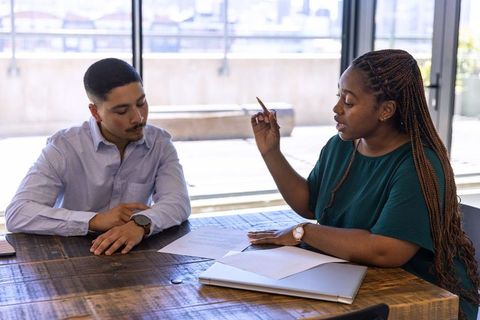 Team members engaged in professional document review discussion