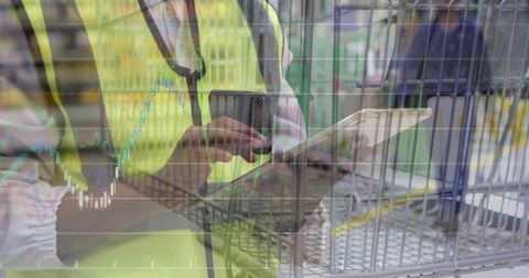 Warehouse worker scanning barcode inventory with tablet and scanner, logistics analytics overlay