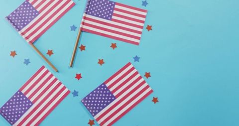 American Flags and Stars Celebrating Patriotism on Blue Background