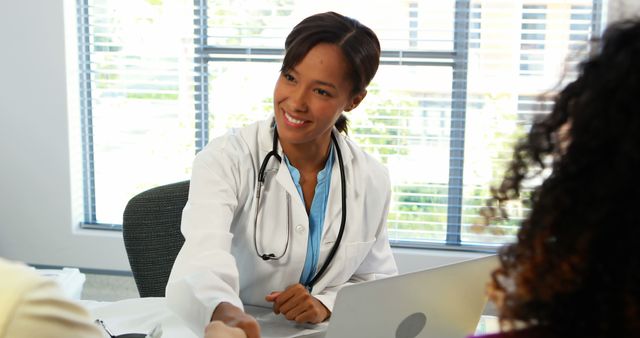 Friendly African American Doctor Greeting Happy Patient in Office - Download Free Stock Images Pikwizard.com