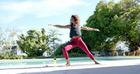 Joyful Woman Practicing Yoga Beside Outdoor Pool - Download Free Stock Images Pikwizard.com